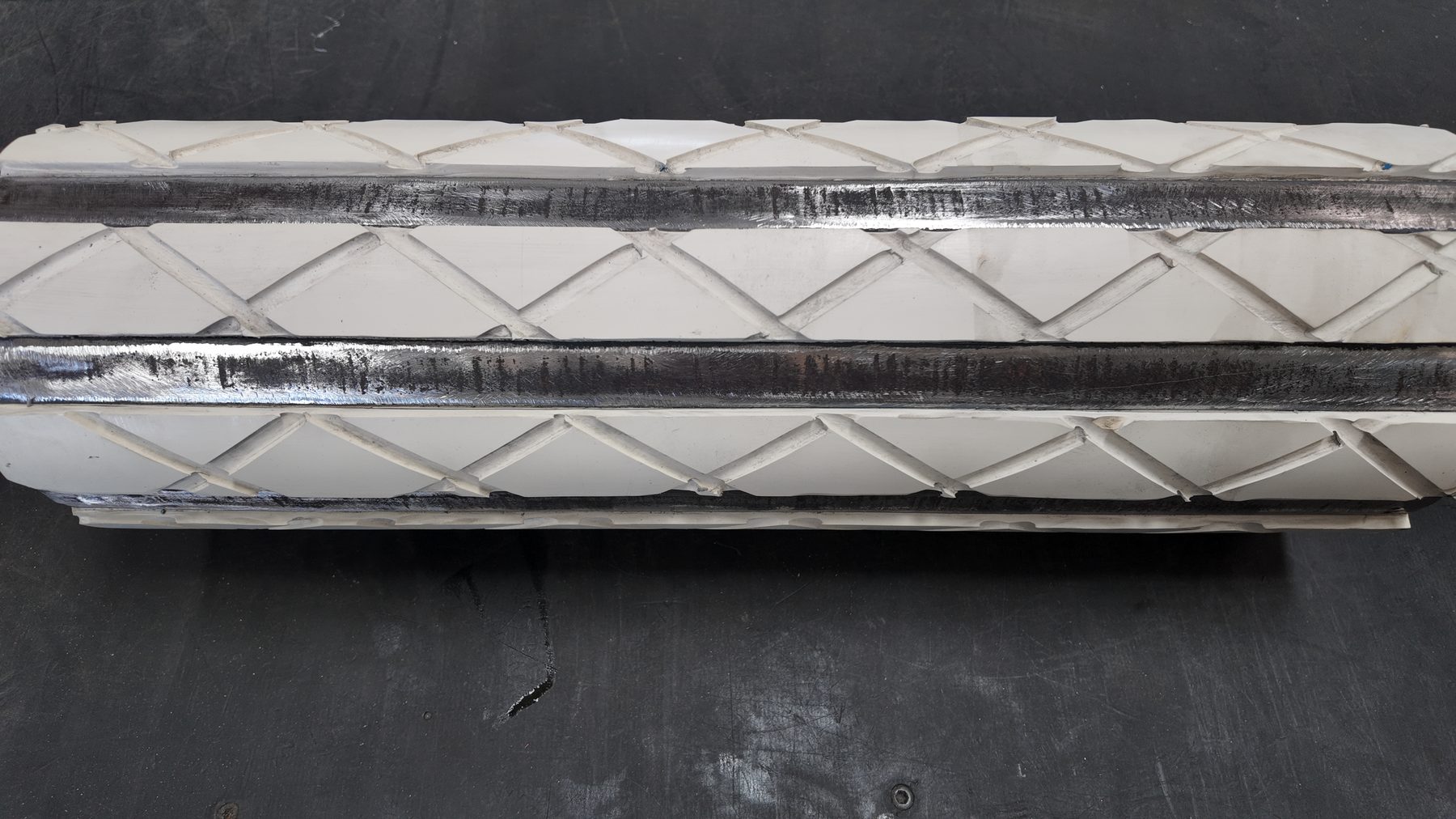 White food grade diamond pattern lagging on a drum motor shell