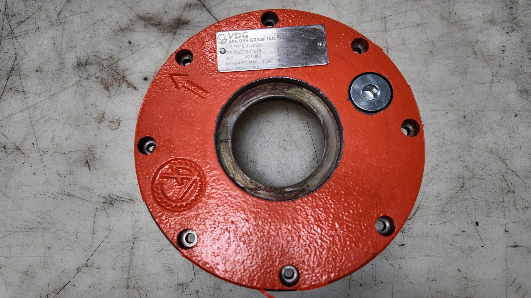 Painted mild steel drum motor end flange with the Van der Graaf ID plate