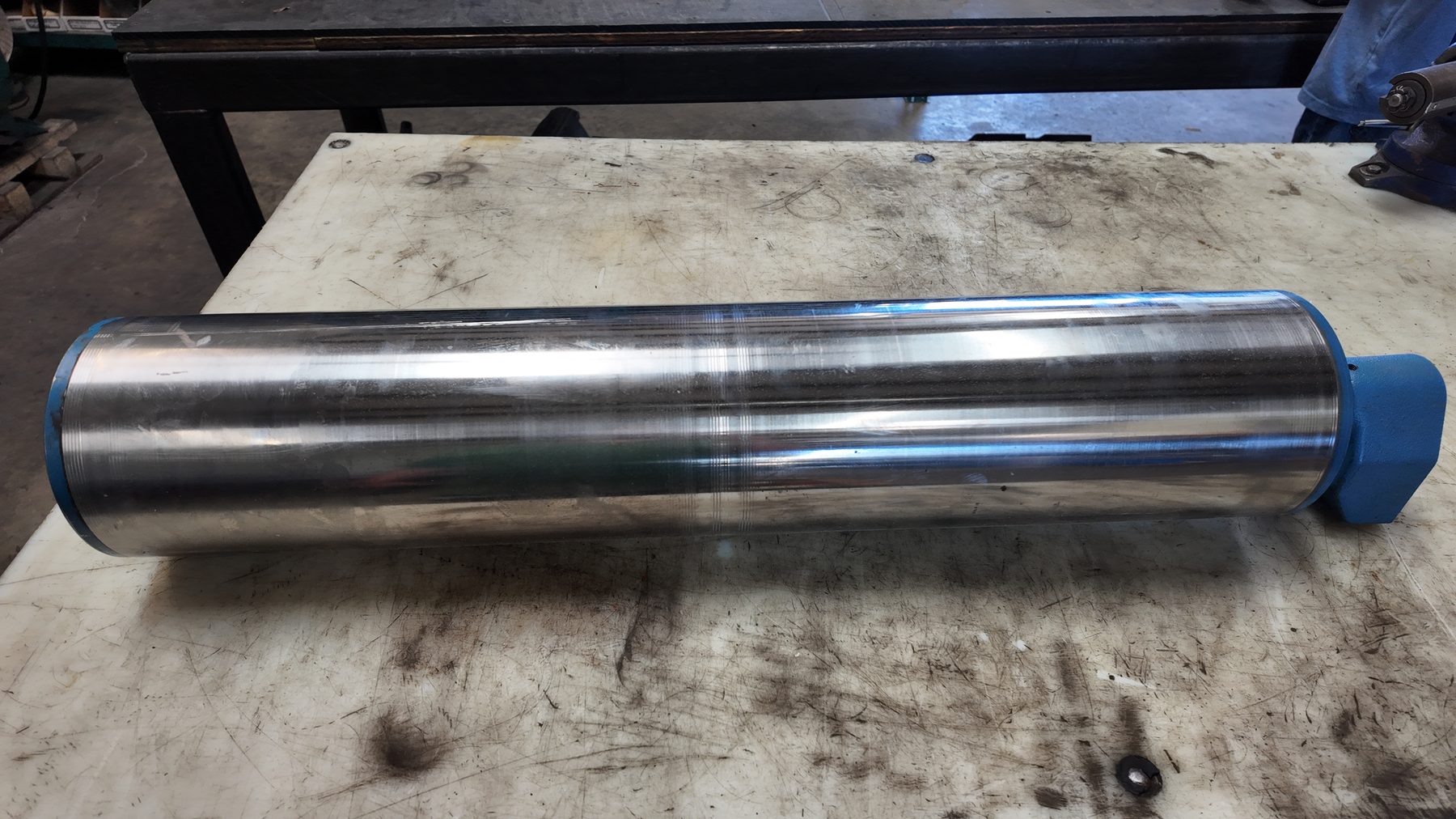 Rebuilt drum motor shell with a machined finish and painted end housing